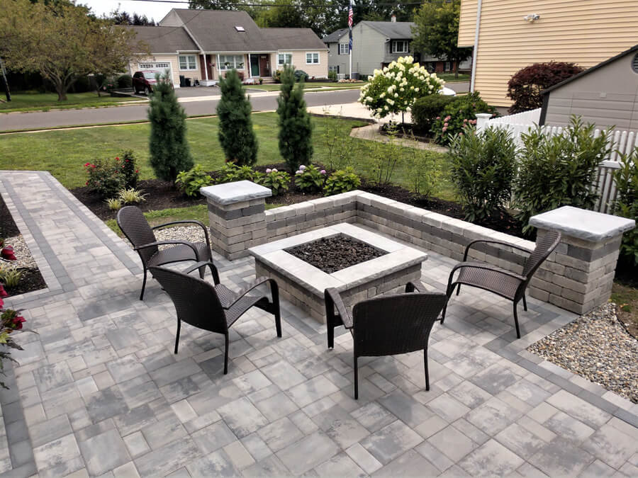 A firepit surrounded by chairs.